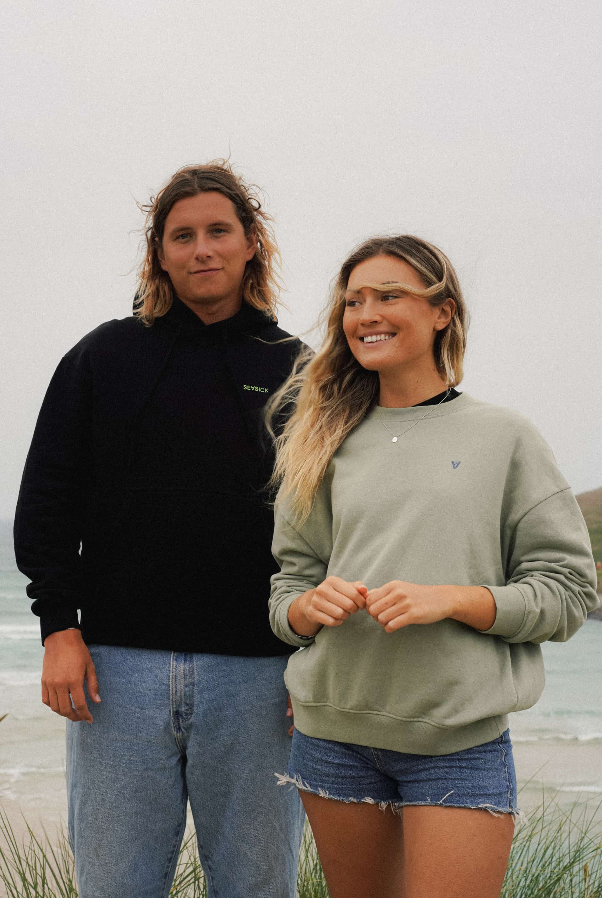 Green unisex sweater with bold back print and front logo stitch by Seasick Studio