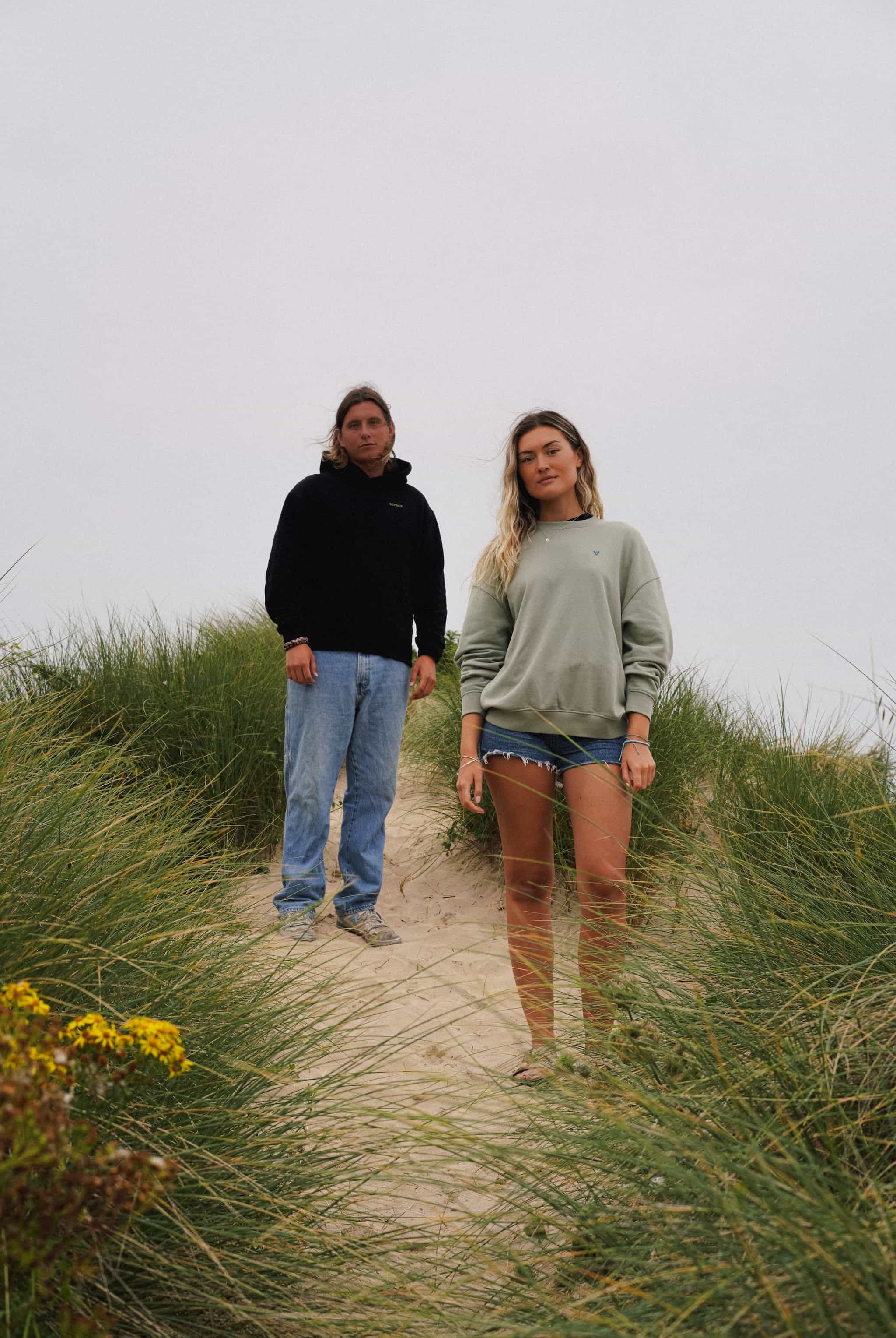 Green unisex sweater with bold back print and front logo stitch by Seasick Studio